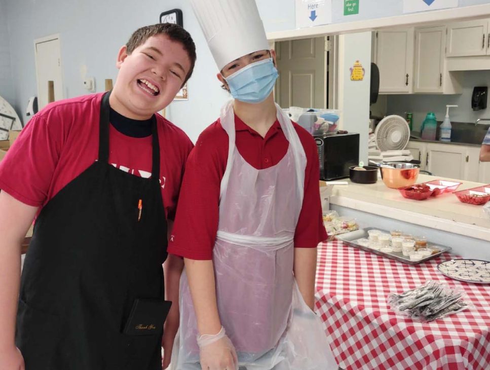 two students learning hands on skills