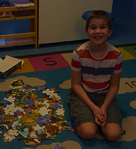 students-looking-at-plant-with-a-magnifying-glass-2024-10-13-19-47-04-utc 1