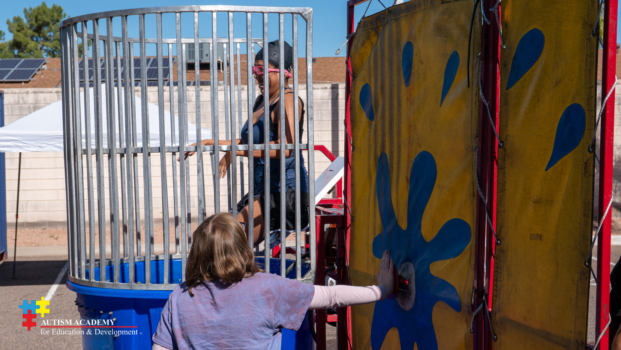 student in dunk tank