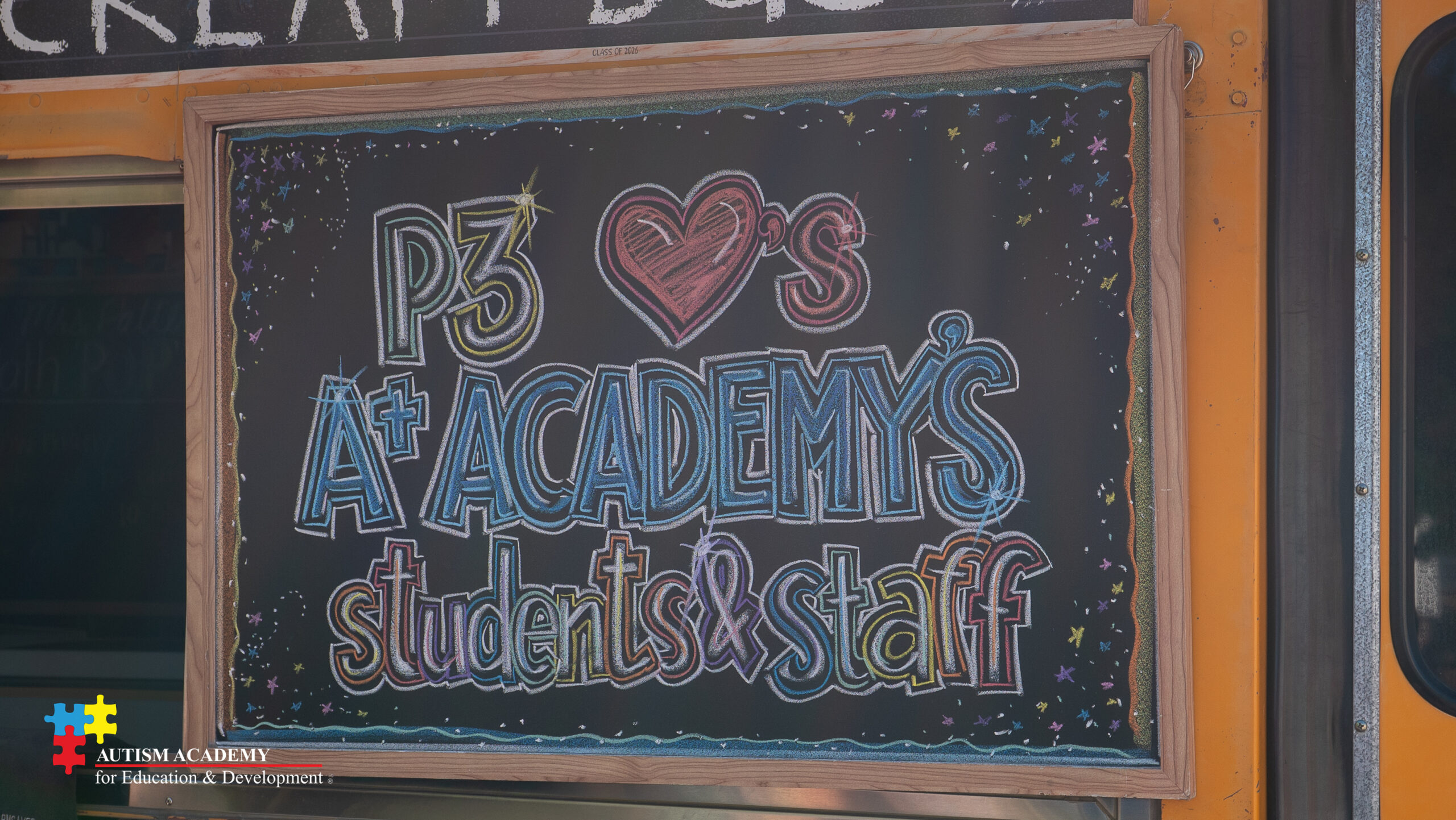 chalk board with words that say P3 Loves A+ Academy