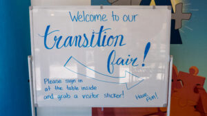 a whiteboard that says welcome to the transition fair